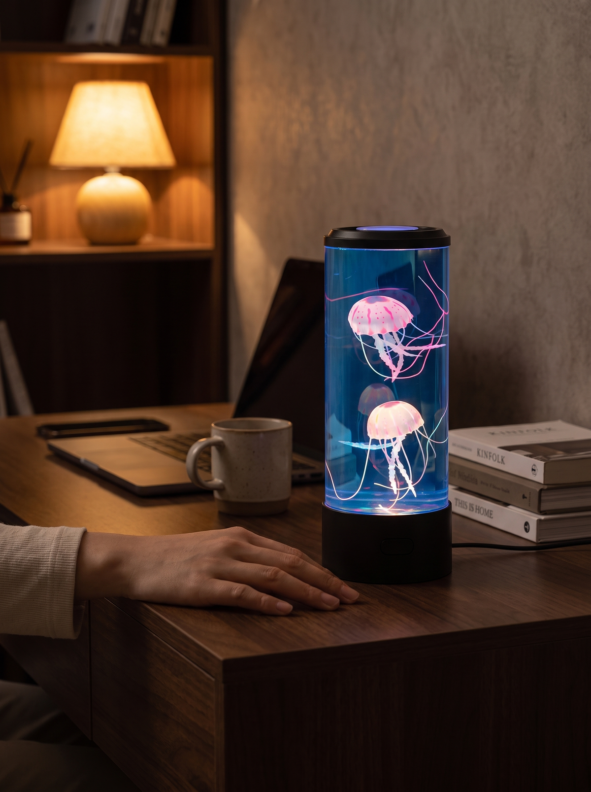 Colour Changing Jellyfish Lamp beside a laptop on a desk
