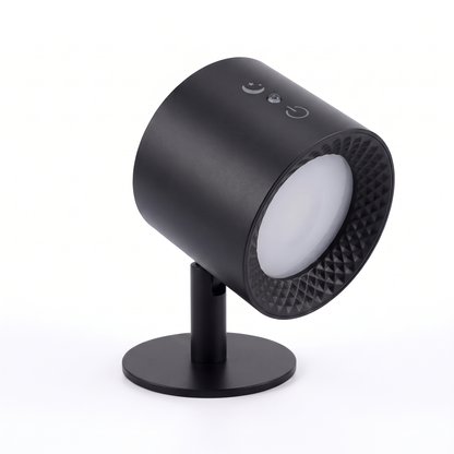 Black rechargeable LED wall light mounted on its flat wall plate